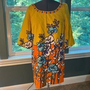 Heavy lined yellow floral a-line statement dress with cabochon jewel collar